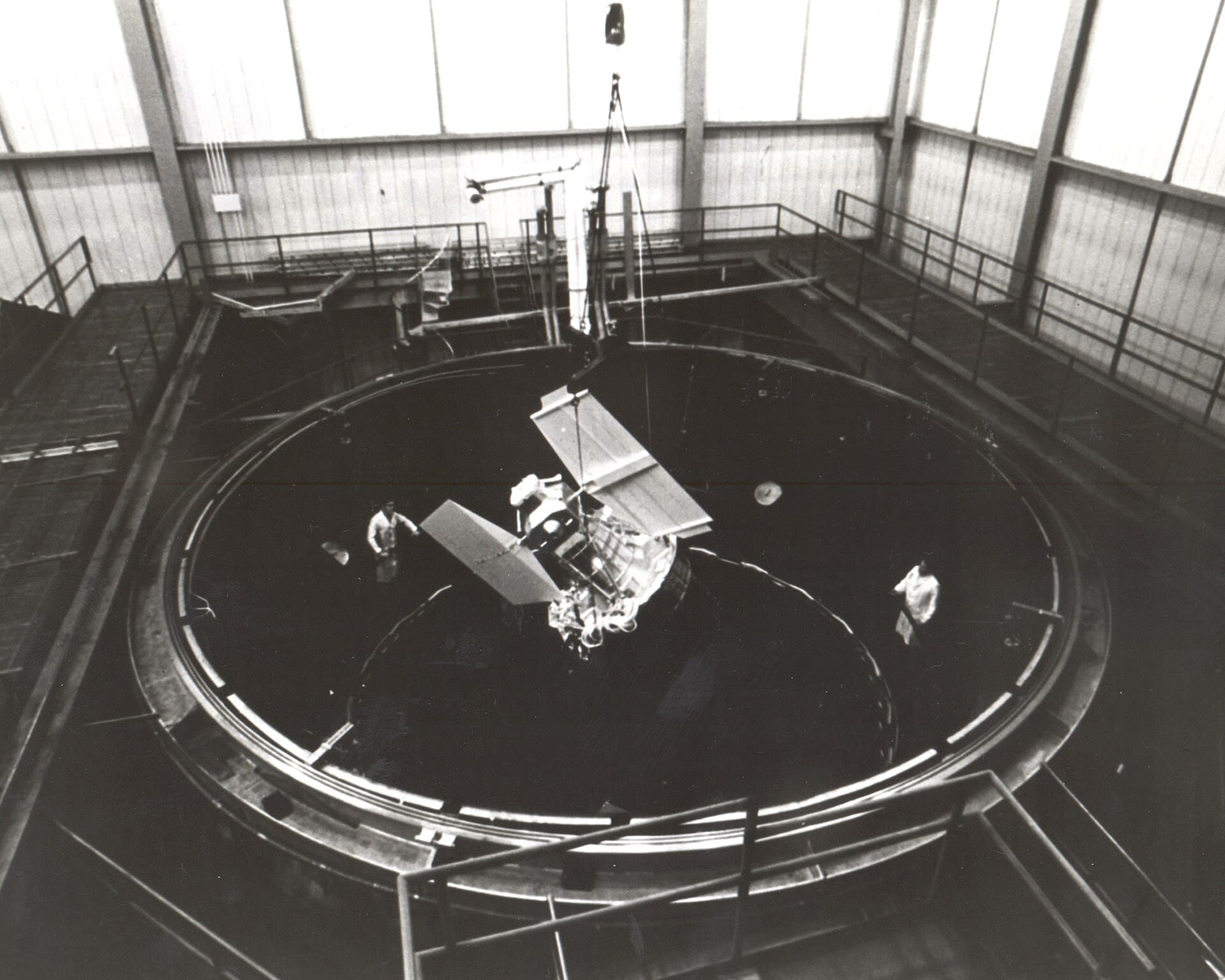 Engineers working on an Earth Resources Technology Satellite